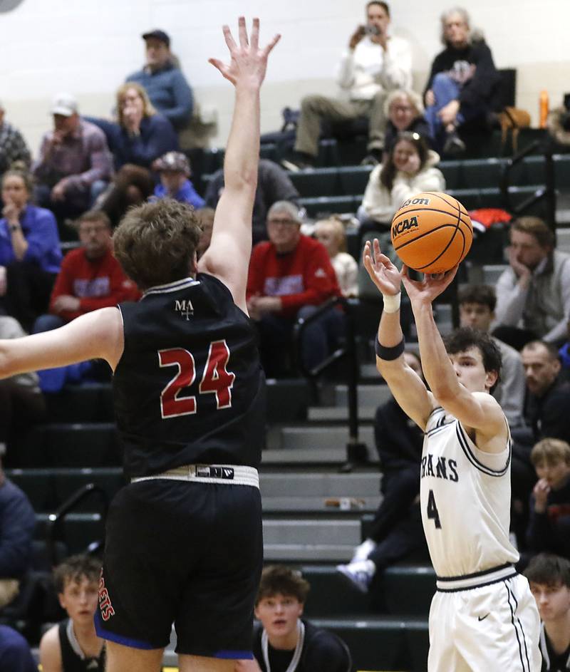 Cary-Grove's Dylan Dumele r\ shoots the ball over Marmion's Alex Eloe during an IHSA Class 3A Crystal Lake South Regional boys basketball semifinal game on Wednesday, February, 25, 2026, at Crystal Lake South High School.