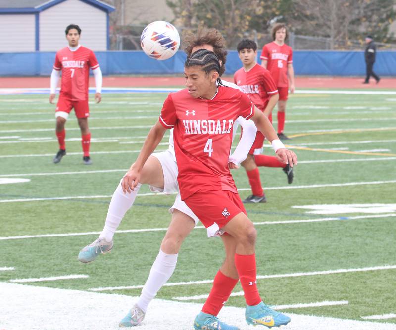 Hinsdale Central's Declan Hoeferlin holds off an Edwardsville defender during the Class 3A State third place game on Saturday, Nov. 9, 2024 at Hoffman Estates High School.