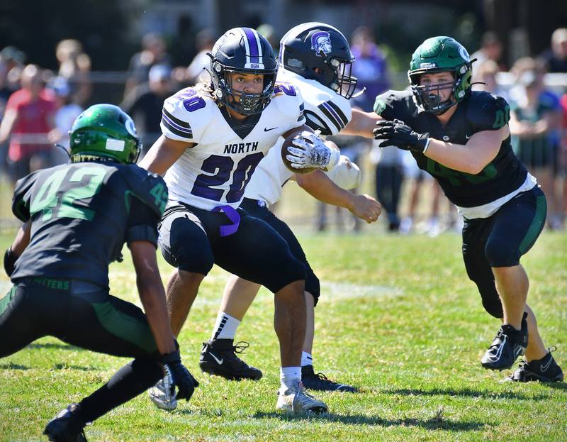 Downers Grove North's Noah Battle (20) looks for a way through the Glenbard West defense during a game on Sep. 9, 2023 at Glenbard West High School in Glen Ellyn.
Jon Cunningham for Shaw Local News Network