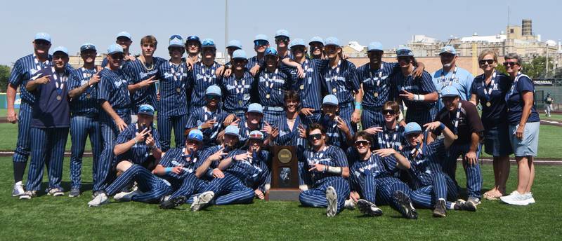 Joe Lewnard/jlewnard@dailyherald.com
Nazareth players pose with their first-place trophy following their 7-2 victory over Grayslake Central during the Class 3A state championship baseball game in Joliet Saturday.