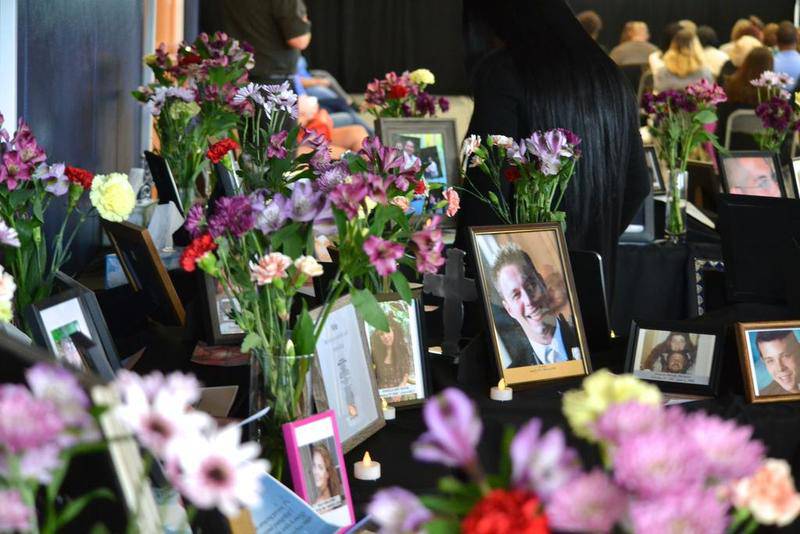 A memorial to several people who recently died because of an opioid overdose is seen Friday at the HERO and HELPS Summit in Romeoville.