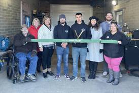 Spring Valley detailing business cuts ceremonial ribbon