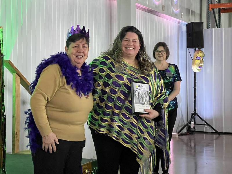 Carolyn Tobinson stands next to Jennifer Irving, with Krissy Johnson behind, on Feb. 11, 2026, during an annual Genoa Area Chamber of Commerce event. Irving had just been given the Dave Tobinson Outstanding Chamber Member award.