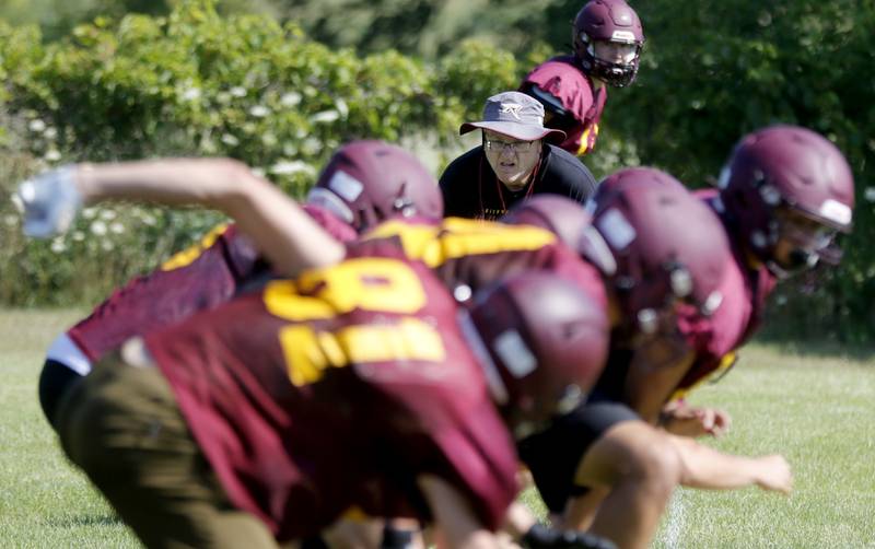Richmond-Burton coach Mike Noll watches an offense drill during summer football practice Thursday, July 27, 2023, at Richmond-Burton High School in Richmond.