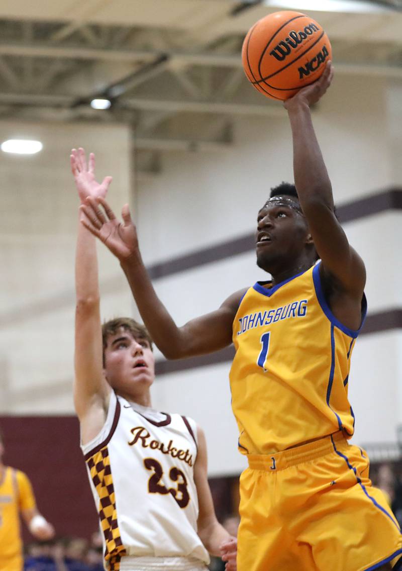 Johnsburg's Jarrel Albea drives to the basket against Richmond-Burton's William Gardner during a Kishwaukee River Conference boys basketball game on Tuesday, Jan. 27, 2026, at Richmond-Burton High School.