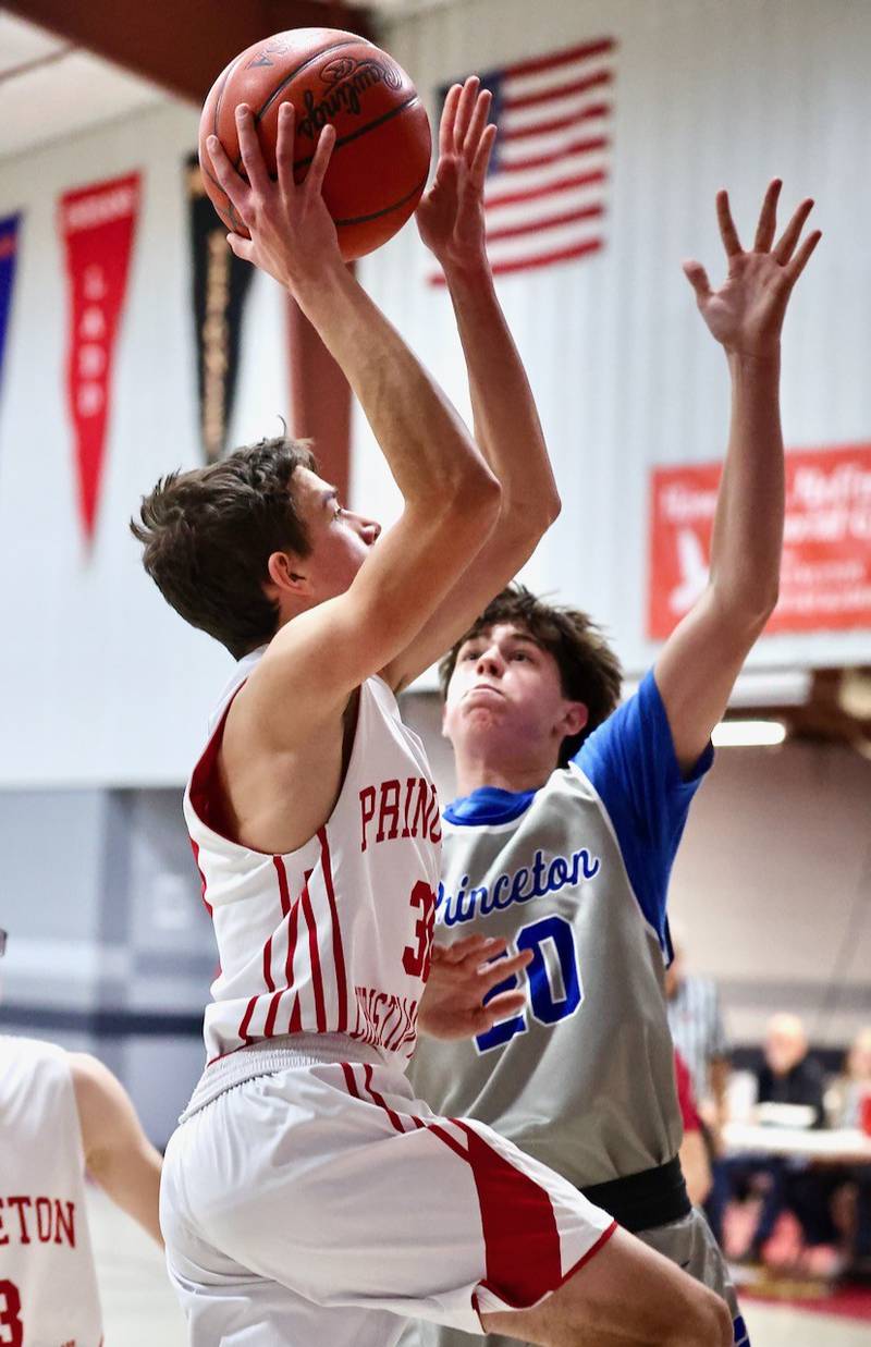 PCA's Matthew Gibson shoots a layup over Princeton's Brody Ross in Thursday's JV game at Howard Hoffman Memorial Gymnasium.