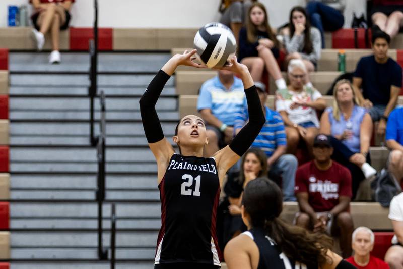 Plainfield North's Maelys Paciero sets-up a teammate during a varsity volleyball home game against Morris on Sept. 2, 2025.