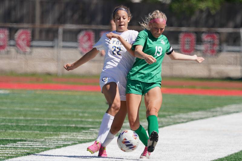 Lyons’ Peyton Israel (22) challenges York’s Ava Hansmann (19) for the ball during a Class 3A Hinsdale Central Sectional girls soccer championship match at Hinsdale Central High School on Saturday, May 25, 2024.