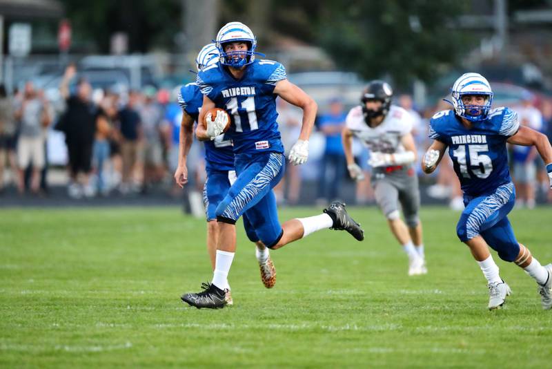 Princeton sophomore Noah LaPorte returns an interception 50 yards for a touchdown to put the Tigers up 27-0 at the end of the first quarter Thursday night at Bryant Field. The Tigers won 60-20.