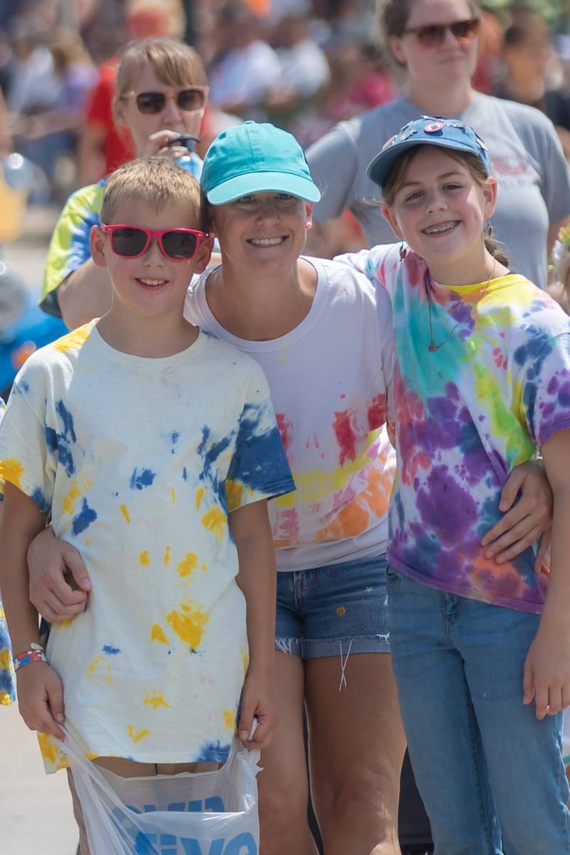 Henry, Sarah and Kasey Habben pose for a photo and promote the Cub Scouts during the Petunia Festival parade on Sunday, July 7, 2024, in Dixon.