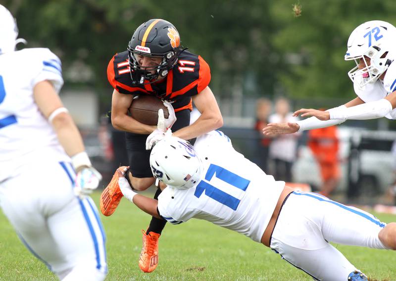 Crystal Lake Central’s Thomas Hammond runs the ball against Burlington Central in varsity football at Crystal Lake Saturday.