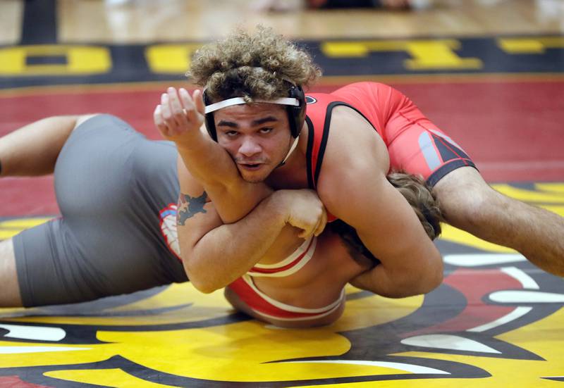 Hunter Birkhoff of Marian wrestles Cameron Lattimore of Grant at 195 pounds during the Batavia wrestling invite Saturday January 14, 2023 in Batavia.