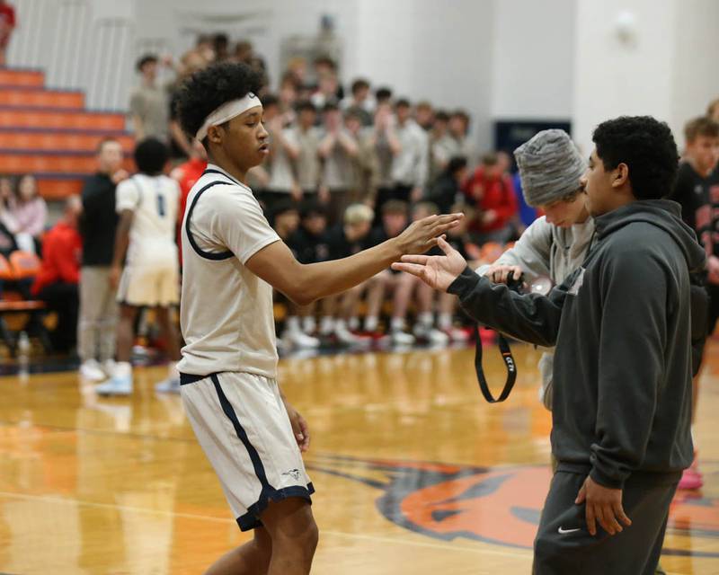 Downers Grove South's Adam Flowers (3) is introduced during pregame introductions before their Class 4A Naperville North Regional final basketball game between Yorkville at Downers Grove South, Feb 27, 2026 in Naperville.