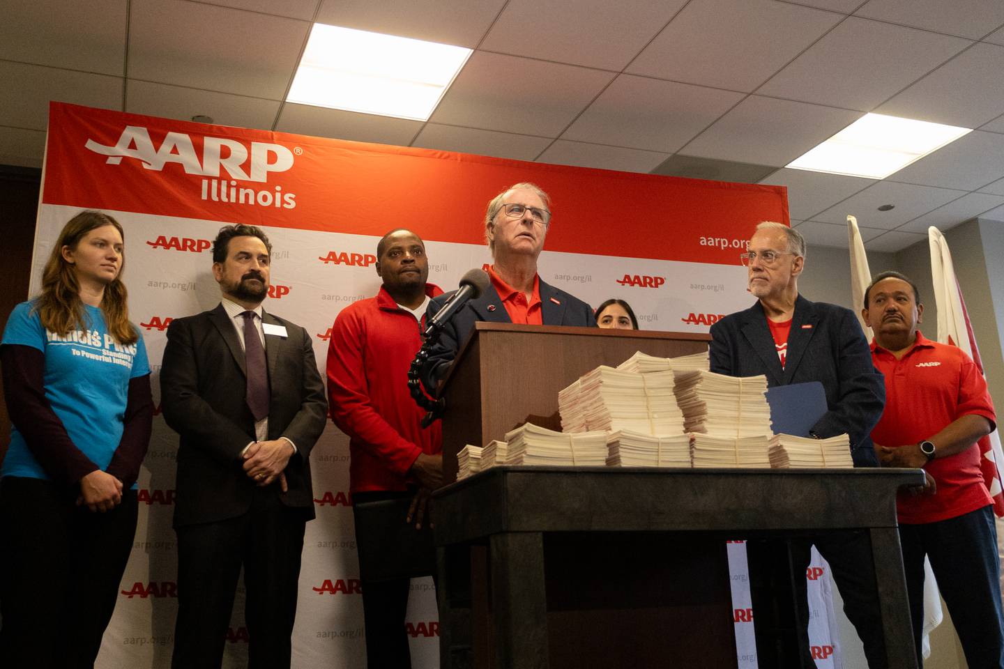 Al Hollenbeck, AARP Illinois’ volunteer state president, speaks at an Oct. 22 news conference alongside representatives from Illinois PIRG and the Citizens Utility Board.