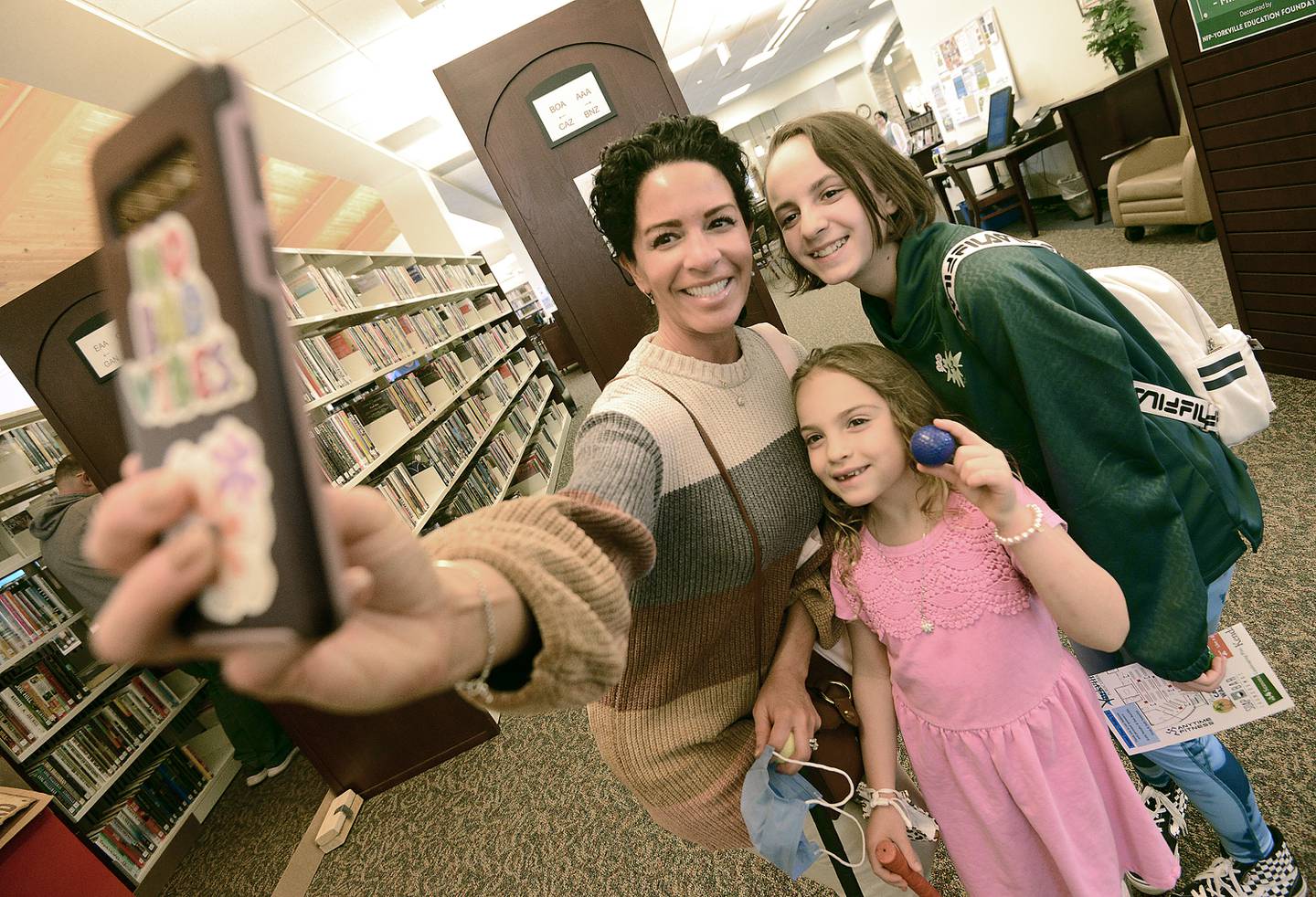Mini golfers of all ages enjoy the game indoors at Yorkville Library’s annual FunRaiser event