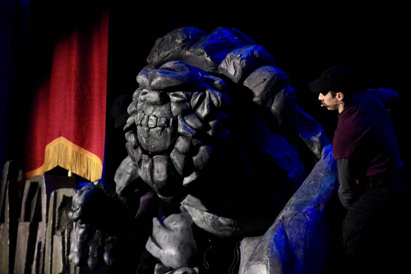 An immense stone troll puppet emerges from the darkness on stage Saturday, Feb. 11, 2023, during the afternoon performance of "Dragons and Mythical Beasts" at Dixon Theatre.