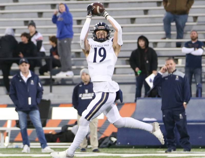 IC Catholic's Eric Karner (19) makes a catch over the middle in the Class 3A State title game on Friday, Nov. 25, 2022 at Memorial Stadium in Champaign.