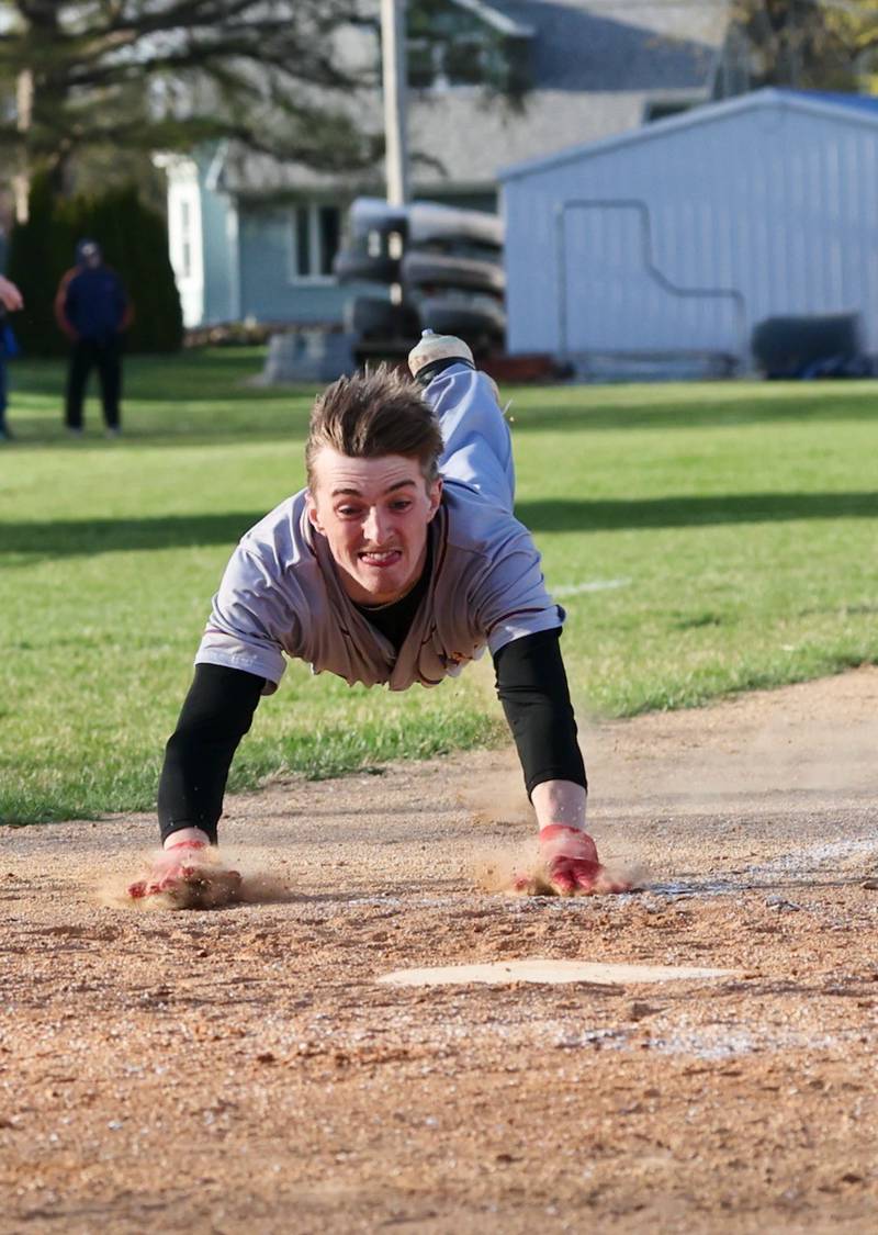Mendota's Jack Gillespie slides in safely at home for the Trojans' second run of the seventh inning and game in a 6-2 loss at Princeton on Monday.
