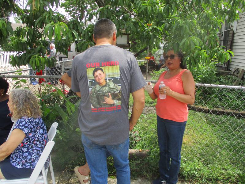 A man at the street dedication ceremony in Joliet wears a T-shirt honoring Staff Sgt. Jose Duenez Jr. Friday, July 11, 2025