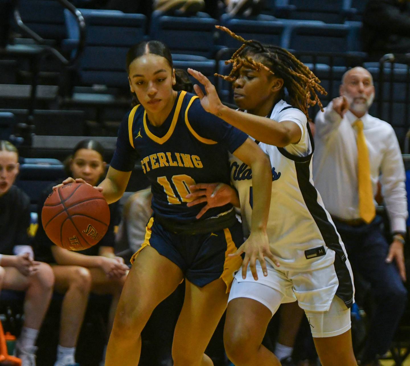 Sterling’s Nia Harris is guarded by Davenport North’s Damia Clark during the IHMVCU Shootout at the Carver Center in Rock Island