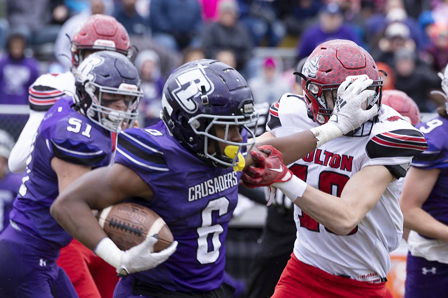 Fulton’s Conner Sheridan gets a hand in the face by Rockford Lutheran’s Arlin Moore Jr. Saturday, Nov. 5, 2022 during a round two football playoff game.