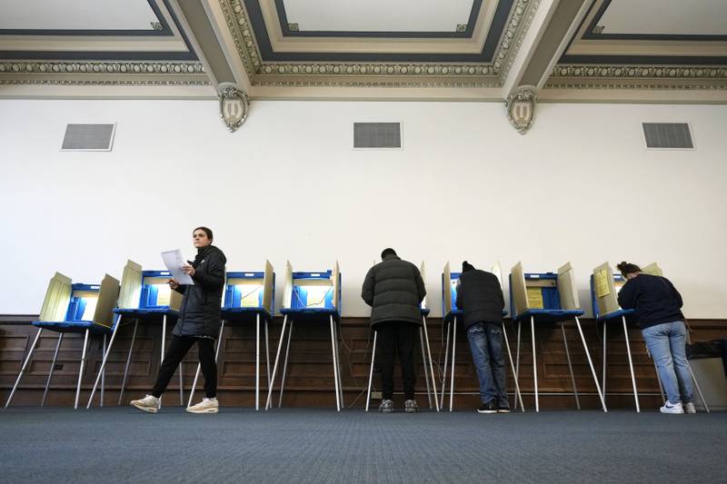 Voters mark their ballots while voting at Centennial Hall at the Milwaukee Central Library on Election Day Tuesday, April 1, 2025, in Milwaukee. (AP Photo/Kayla Wolf)