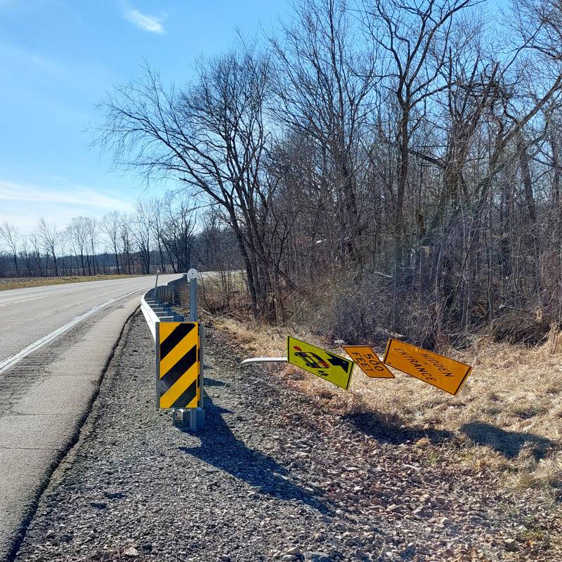 Street signs along Route 18 were blown over after the EF-1 tornado Thursday, Feb. 8, 2024, in Putnam County.