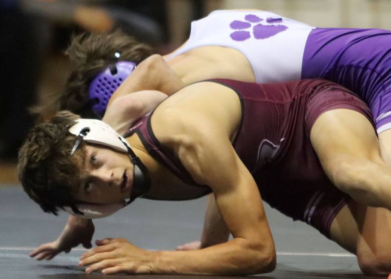 Prairie Ridge’s Tymen Robinson, bottom, battles Hampshire’s Luthor Rajcewicz at 106 pounds in varsity boys wrestling on Thursday, Dec. 4, 2025, at  Prairie Ridge High School in Crystal Lake.