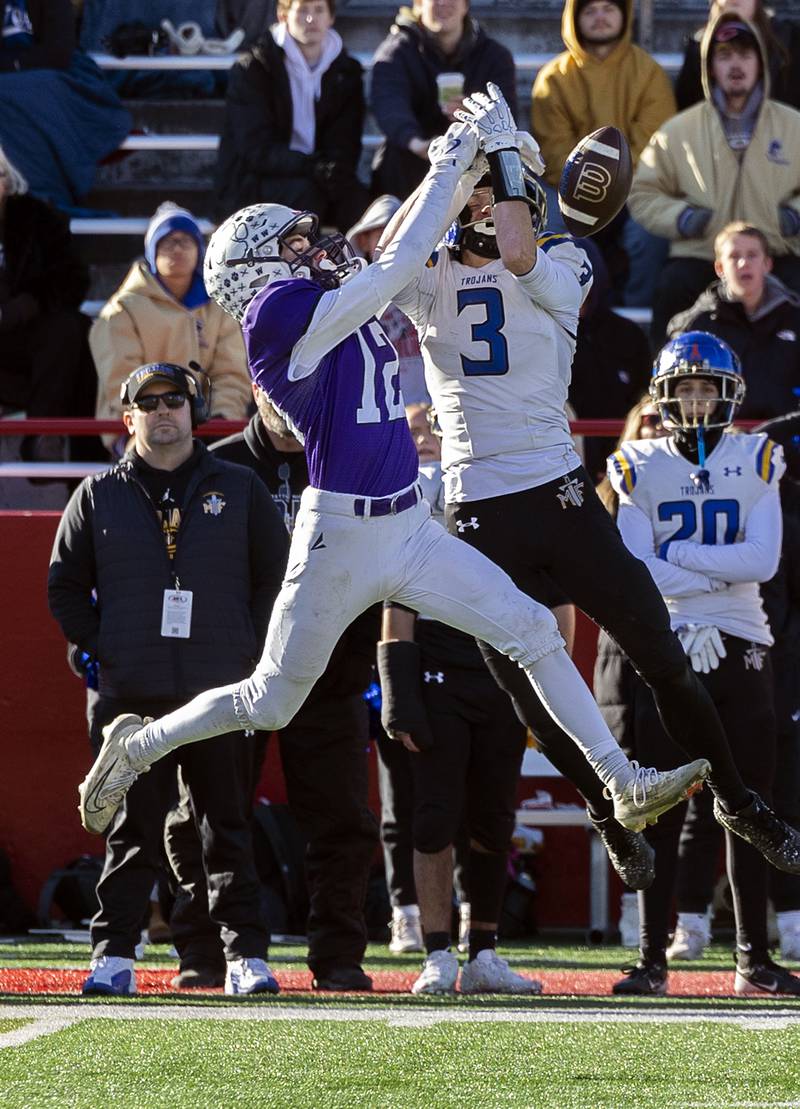 Wilmington’s Cole Boersma (left) defends Maroa-Forsyth's Cayden Birmingham on a pass Friday, Nov. 28, 2025, in the Class 2A football finals at Hancock Stadium at ISU.
