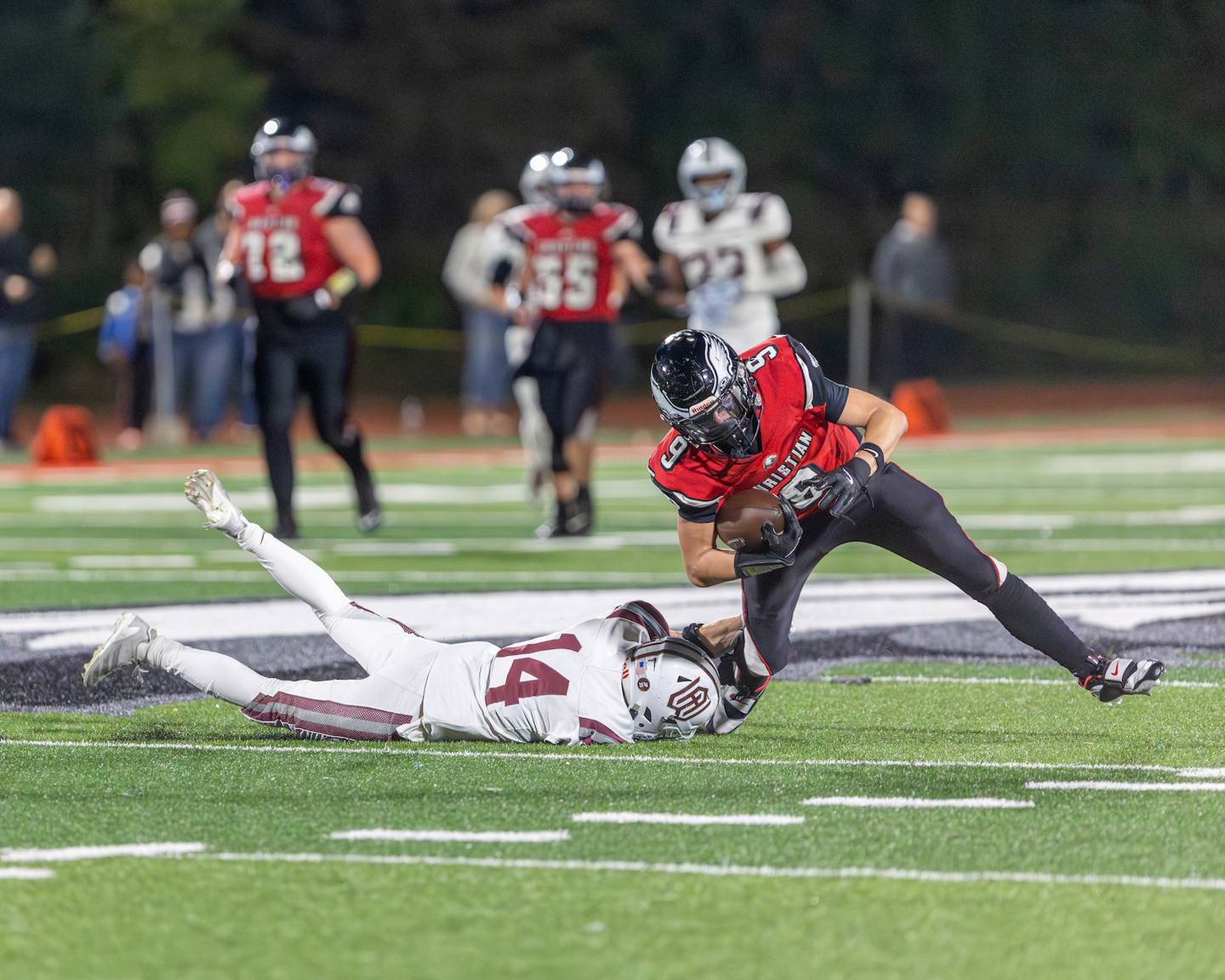 Wheaton Academy's John Mazzerella makes the tackle on Aurora Christian's Dom Klimpke on Friday, Oct. 17,2025 in Aurora.