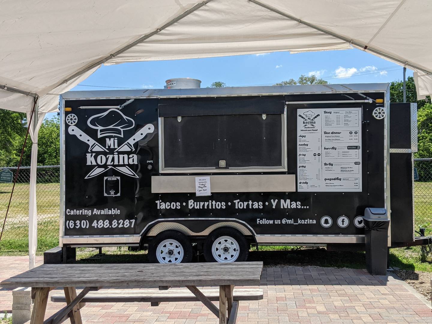 Mi Kozina food truck is currently located on the property near the building.