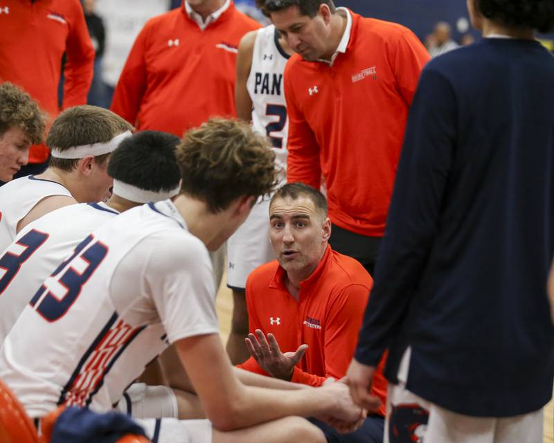 Oswego's head coach Nick Oraham addresses the team during a timeout in their basketball game between Oswego East at Oswego Friday, Jan 9, 2026 in Oswego.