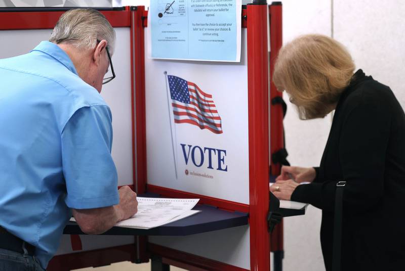 Dan Walker and his wife Linda, from Sycamore, vote Thursday, Sept. 26, 2024, during the first day of early voting for the Nov. election at the DeKalb County Legislative Center in Sycamore.