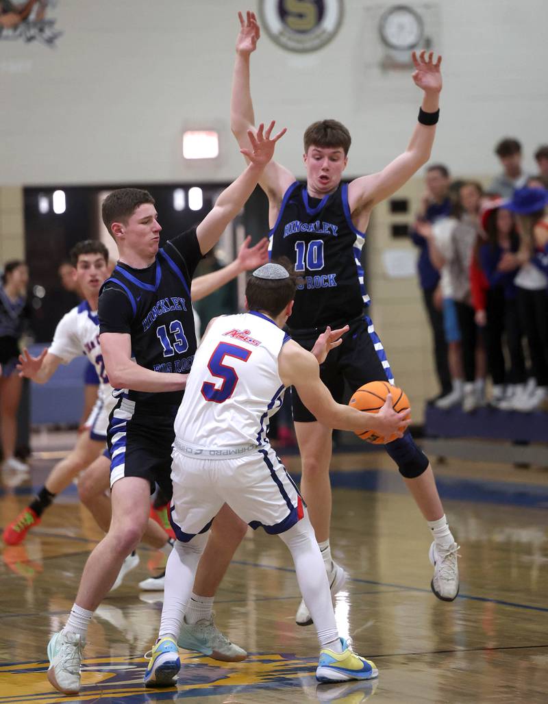 Hinckley-Big Rock's Jacob Orin (left) and Max Hintzsche trap Ida Crown’s Juday Well during their Class 1A sectional game Wednesday, March 5, 2025, at Somonauk High School.