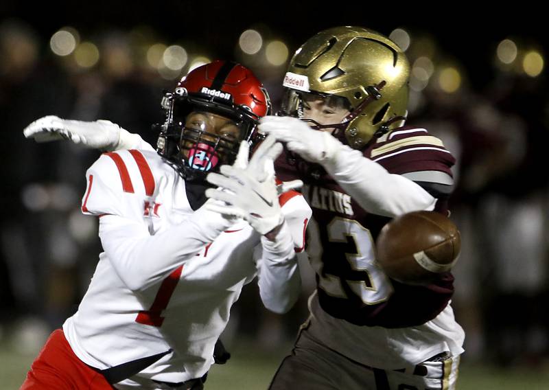 Huntley's Bryce Walker can’t catch the ball infant of St. Ignatius' Liam Doyle during a IHSA Class 8A second round playoff football game on Friday, Nov. 3, 2023, at St. Ignatius College Prep in Chicago.