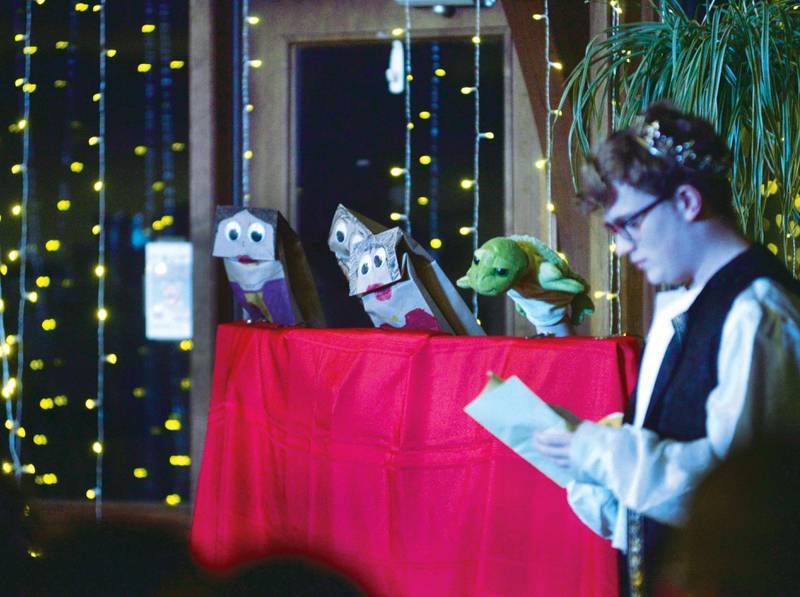 Prince Caleb Ward talks with enchanted puppets during Oregon High School's Madrigal dinner on Saturday, Dec. 7, 2024. The event was held at the Brubaker Center at Stronghold Camp & Retreat Center north of Oregon. The troupe also performed on Friday. Dec. 6.