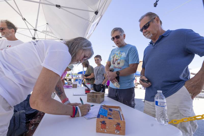 Jeff Capponi and Dave Stoens sign up to compete in the Chuck Rolinski's Labor Day Bocce Tournament in Toluca on September 1, 2024.