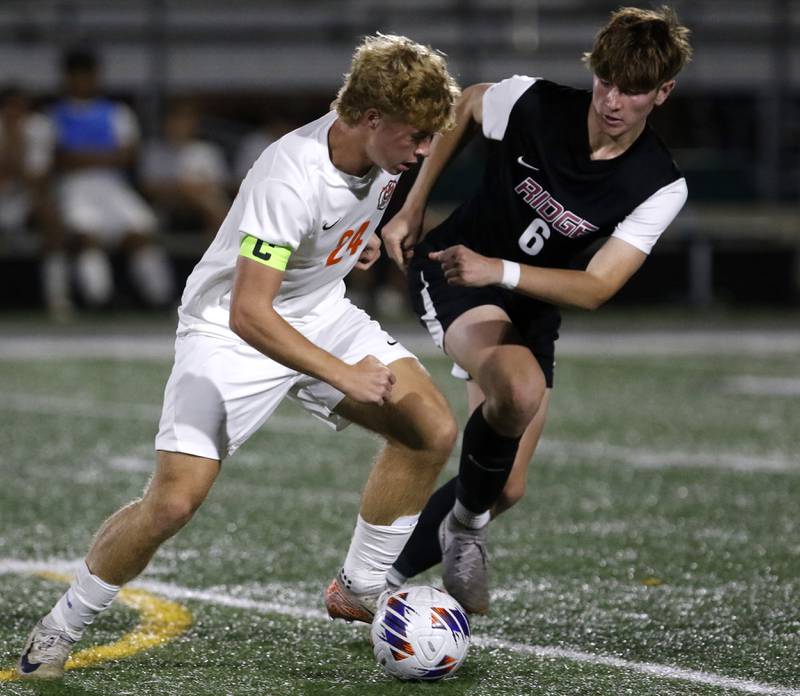 Crystal Lake Central’s Gavin Kane tries to control the ball as Prairie Ridge's Matthew Fireng defends during the IHSA Boys Soccer 2A Grayslake Central Sectional semifinal match on Tuesday, Oct. 29, 2024, at Grayslake Central High School,