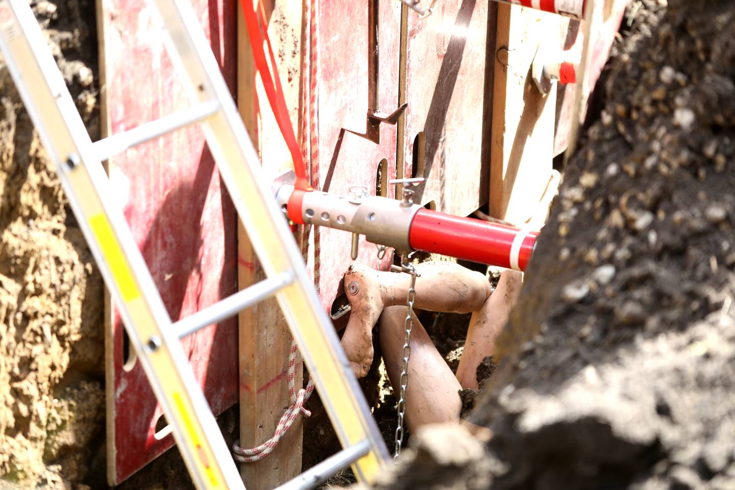 The feet of a training mannequin stick out as the Kane County Technical Rescue Team, which is made up of fire and medic responders from Elburn, Geneva, St. Charles, North Aurora, St. Charles, Aurora, Batavia and West Chicago, participate in a trench rescue training exercise in Geneva on Friday, May 10, 2024.