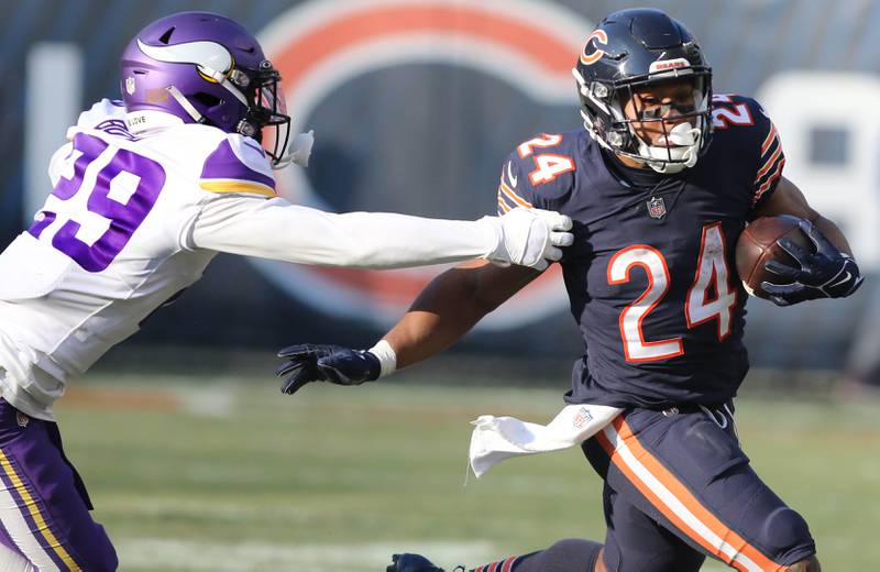 Chicago Bears running back Khalil Herbert gets outside of Minnesota Vikings cornerback Kris Boyd Sunday, Jan. 8, 2023, during their game at Soldier Field in Chicago.