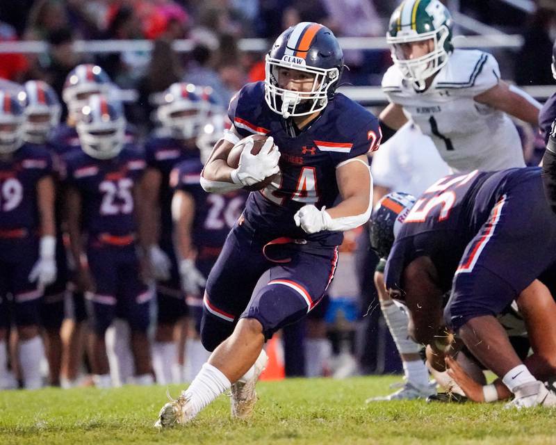 Oswego’s Ayden Villa (24) carries the ball against Plainfield Central during a football game at Oswego High School on Friday, Sept. 8, 2023.