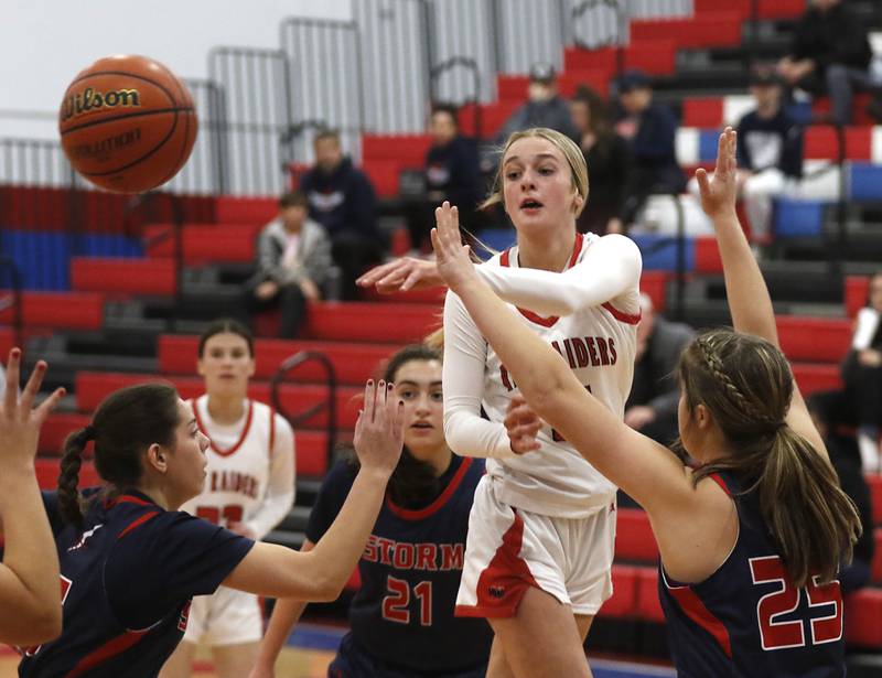 Huntley’s Anna Campanelli passes the ball as he drive she lane against South Elgin’s Madison Hunt on Tuesday, Nov. 21, 2023, during a basketball game in the Dundee-Crown High School Girls Thanksgiving Tournament in Carpentersville.