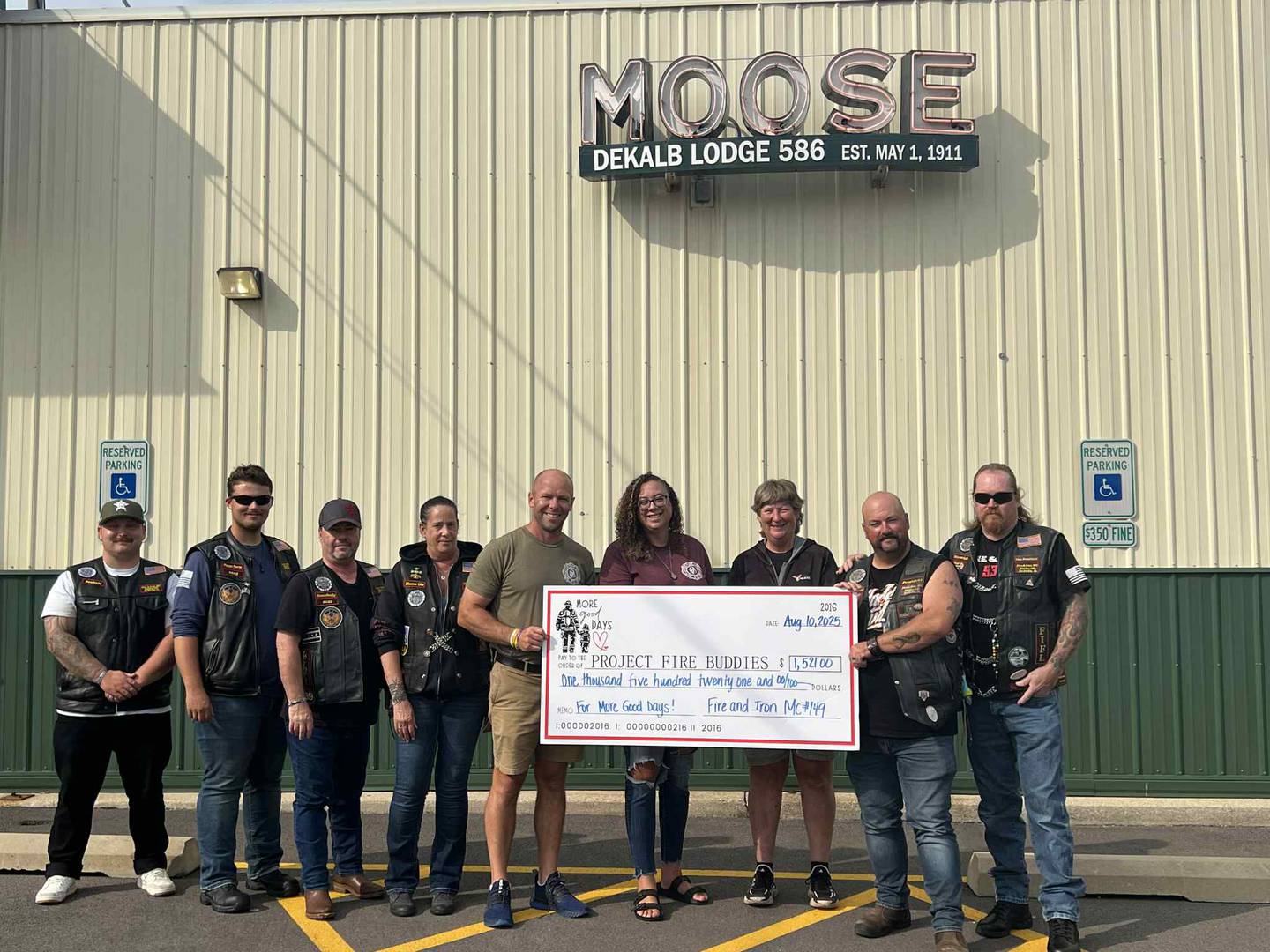 Fire and Iron Station No. 149 presents a check for $1,521 raised on July 12, 2025, for the Sycamore chapter of Project Fire Buddies.