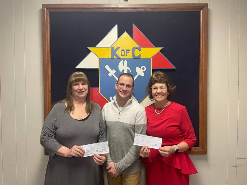 Kyle Foley (center), grand knight of Calvert Council Knights of Columbus in La Salle, presented Wednesday, Jan. 31, 2024, checks of $3,485.16 each to Alice Buczkowski (left), administrative assistant at Horizon House, and Jessica Kreiser (right), executive director of Lighted Way. The donations were funded by the Knights' annual Tootsie Roll drive.