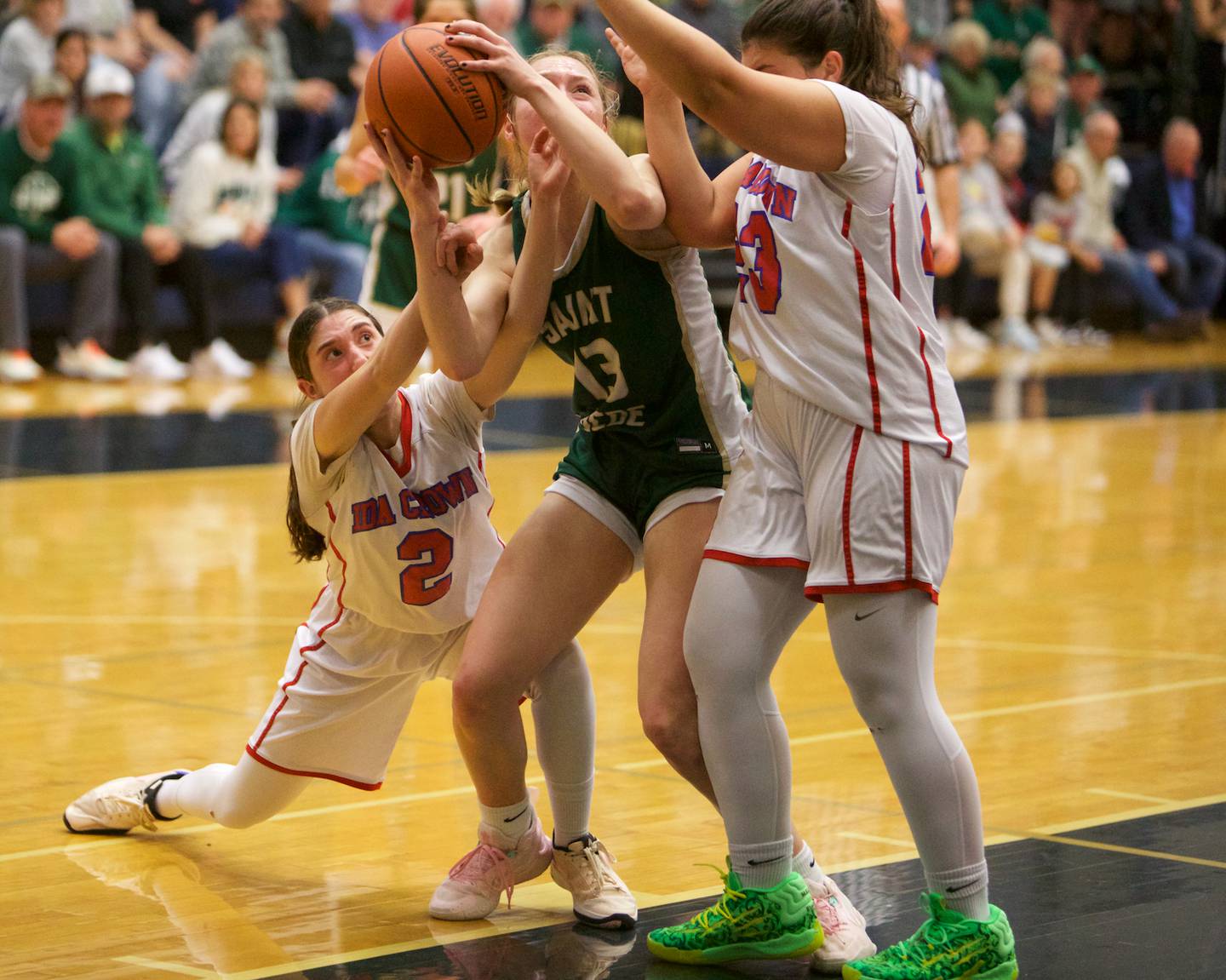 St. Bede's Ashlyn Ehm battles for the loose ball with Ida Crown's Daria Lennon (2) and Eliya Sander (23) at the Class 1A Girl's Basketball Super Sectional on Monday , Feb.26, 2024 at Harvest Christian Academy  in Elgin.