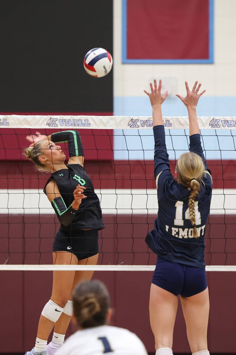 Providence's Demi Carbone spikes the ball over Lemont's Kaitlyn Wilson during Providence's victory in two sets, 25-25, 25-18, over Lemont in the IHSA Class 3A Kankakee Sectional championship on Thursday, Nov. 6, 2025.