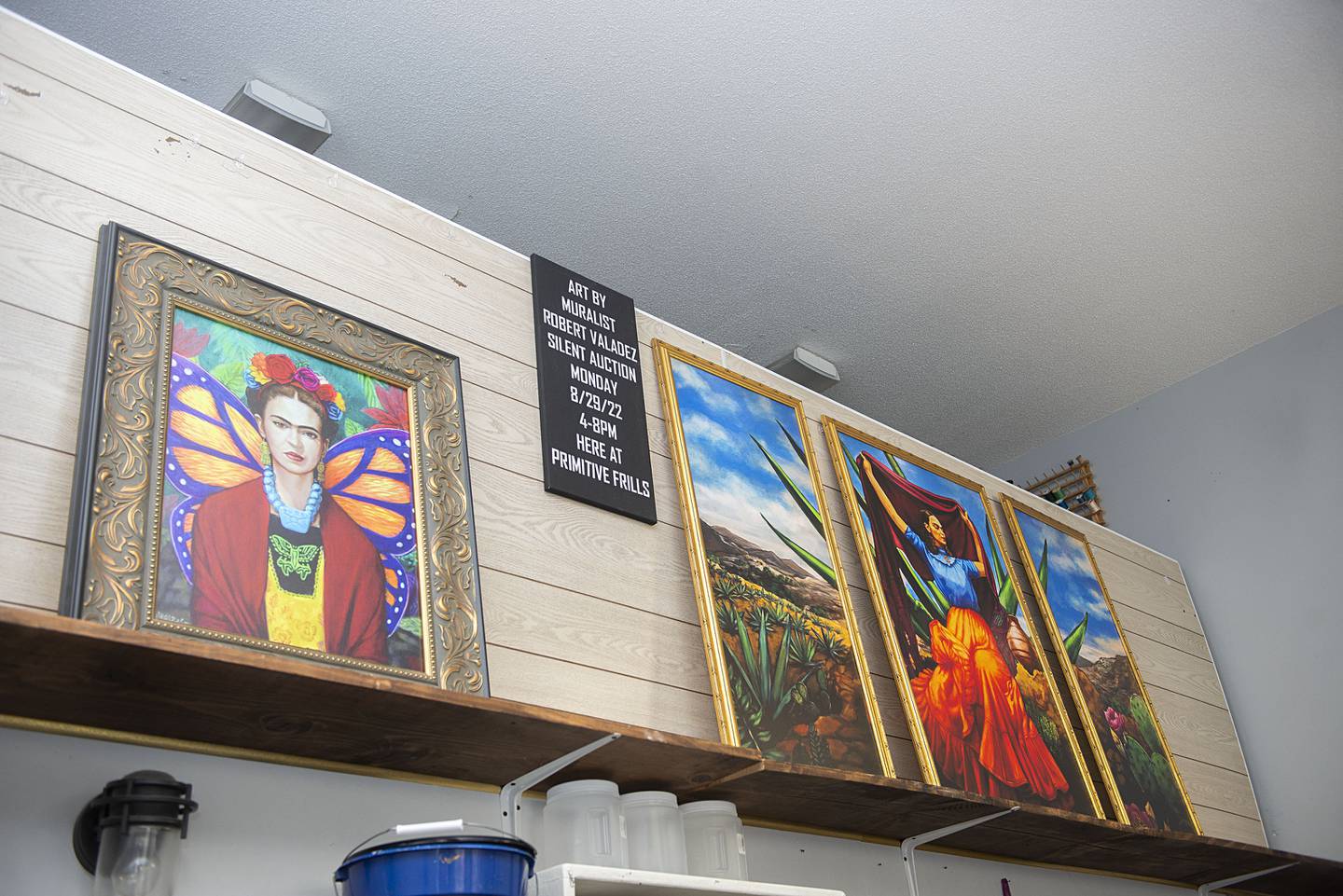 Monday’s reception was held at Primitive Frills in downtown Sterling. The store is hosting a silent auction of two of Valdez’ works and also has prints of his for sale.