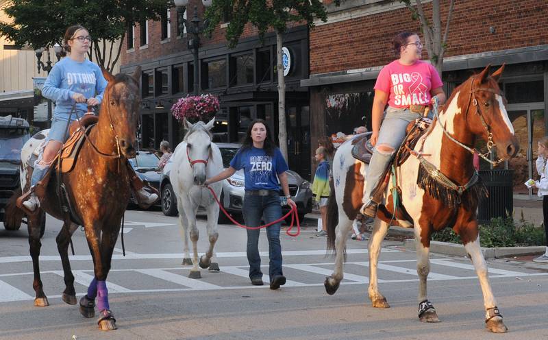 The The Ottawa Township High School FFA show their horses the way down LaSalle St in Ottawa Tuesday evening during the school’s Homecoming Parade.