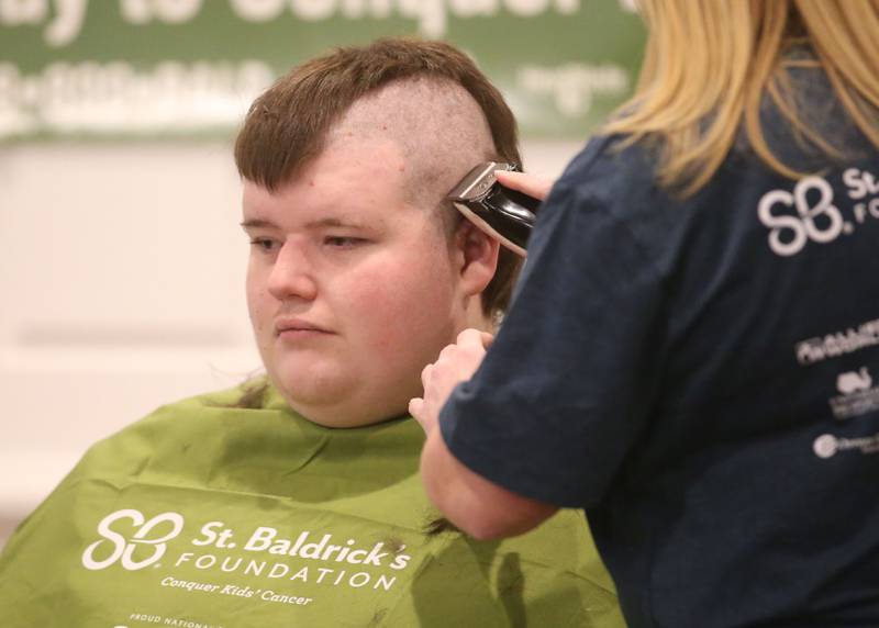 Waltham Scout John Boile, has his head shaved during the 18th annual Illinois Valley Emergency Services St. Baldrick's event on Sunday, March 23, 2025 at Senicas Oak Ridge in La Salle.