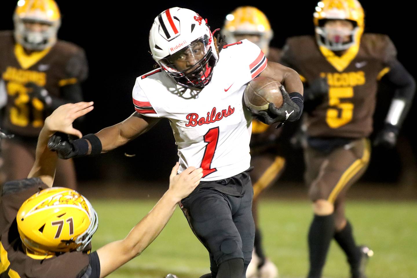 Bradley-Bourbonnais’  Kyren Edmon runs the ball in first-round IHSA football playoff action on Friday, Nov. 1, 2024, at  Jacobs High School  in Algonquin.